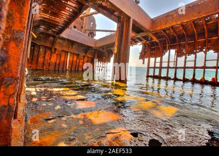 Interior of rusty shipwreck in Greece full of sea water in Glyfada beach near Gytheio, Gythio Laconia, Peloponnese, Greece. Stock Photo