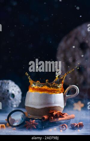 Astrology or astronomy themed teatime with ceramic cup, splash and handmade moons Stock Photo