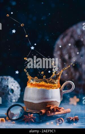 Astrology or astronomy themed teatime with ceramic cup and Big Dipper constellation splash Stock Photo