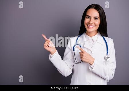 Close-up portrait of her she nice attractive confident brunet girl showing copy space professional medical aid help insurance consultation new novelty Stock Photo