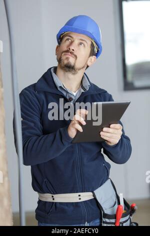 worker using a tablet in a construction site Stock Photo