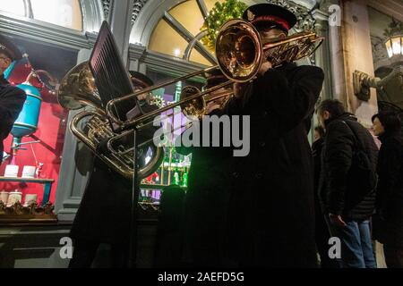 A Salvation Army brass band play carols on Piccadilly in central London Stock Photo