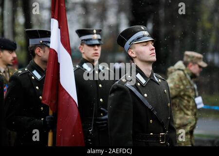 Bucharest, Romania - December 01, 2019: Latvian soldiers in ceremonial uniforms take part at the Romanian National Day military parade during a snowy Stock Photo