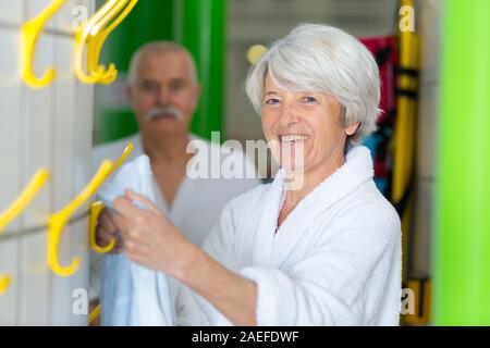 senior woman before taking a shower in the gym Stock Photo