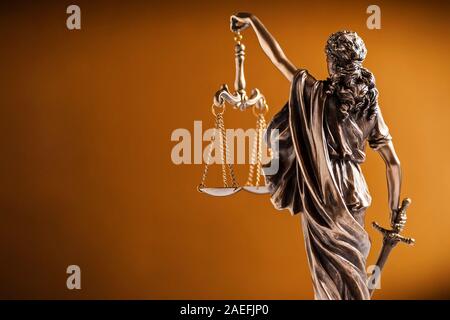 Rear view of a small statue of Lady Justice Stock Photo