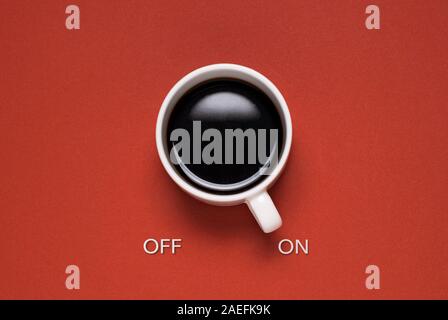 Fun concept of a mug of coffee control switch Stock Photo