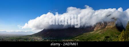 Table Mountain under huge white cloud on blue sky background beautiful landscape panorama, scenery panoramic view, capital city Cape Town South Africa Stock Photo