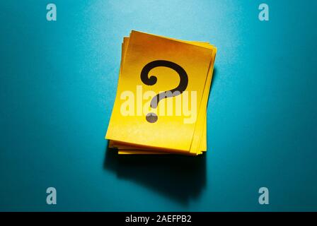 Stack of colorful yellow cards with question mark Stock Photo