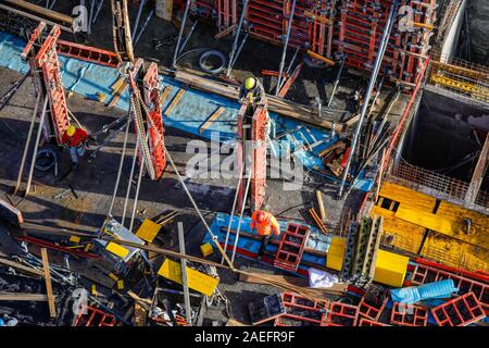 Oberhausen, Ruhr area, North Rhine-Westphalia, Germany - Construction workers are working on concrete formwork on a construction site. Oberhausen, Ruh Stock Photo