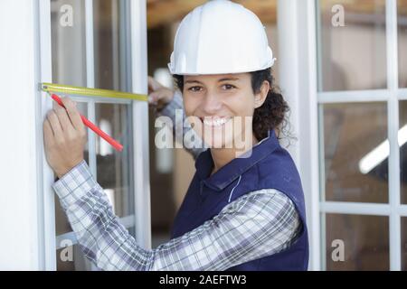 portrait of female window fitter at work Stock Photo