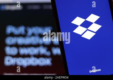 Los Angeles, USA - 10 March 2020: Dropbox app logo on phone screen close up with website on blurry background, Illustrative Editorial Stock Photo