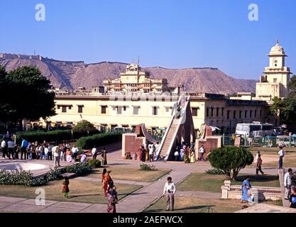 Elevated view of people looking at the giant sundial known as the Samrat Yantra at Jantar Mantar Jai Singhs Observatory with the City Palace also know Stock Photo