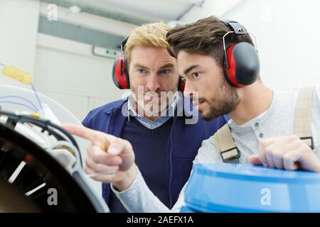 confident engineers working in the factory Stock Photo