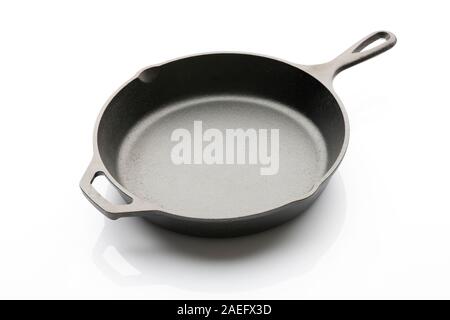 Side View of Seasoned Cast Iron Skillet on White Background Stock Photo