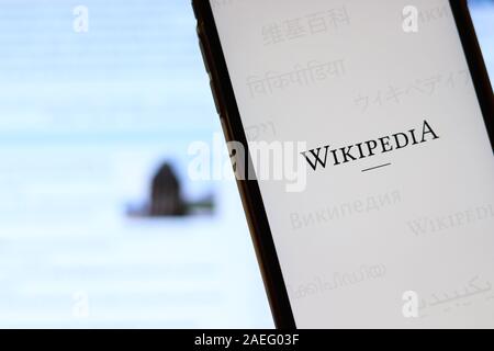 Los Angeles, California, USA - 21 November 2019: Wikipedia logo on phone screen with icon on laptop on blurry background, Illustrative Editorial. Stock Photo