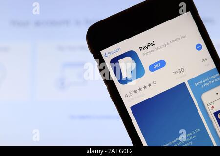 Los Angeles, California, USA - 21 November 2019: Paypal.com logo on phone screen with icon on laptop on blurry background, Illustrative Editorial. Stock Photo