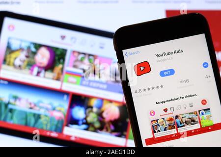 Los Angeles, California, USA - 26 November 2019: YouTube Kids icon on phone screen with logo on blurry background, Illustrative Editorial. Stock Photo