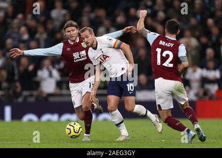 Harry Kane of Tottenham Hotspur in action with Jeff Hendrick (L) and Robbie Brady (R) of Burnley - Tottenham Hotspur v Burnley, Premier League, Tottenham Hotspur Stadium, London, UK - 7th December 2019  Editorial Use Only - DataCo restrictions apply Stock Photo