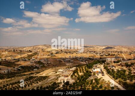 Israel, West Bank, Village in the Judaea desert, as seen from Herodion a castle fortress built by King Herod 20 B.C.E. Stock Photo