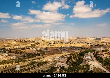 Israel, West Bank, Village in the Judaea desert, as seen from Herodion a castle fortress built by King Herod 20 B.C.E. Stock Photo