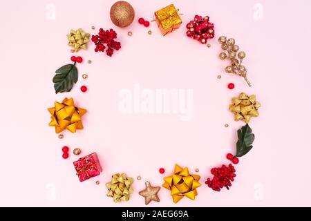 Christmas wreath on pink background. Christmas decoration. Flat lay, top view, copy space Stock Photo