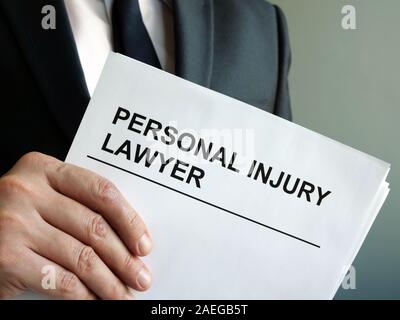 Personal injury lawyer with clipboard and law. Stock Photo
