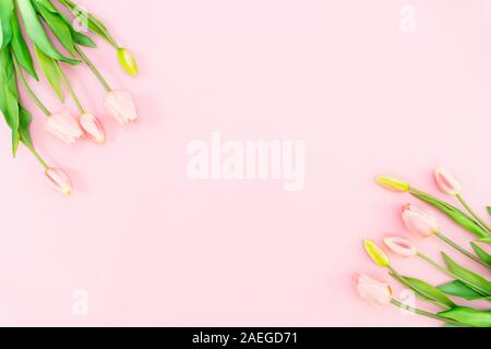 Valentine's Day composition. Tulip flowers on pink background. Valentine's day, Mother's day concept. Flat lay, top view, copy space Stock Photo