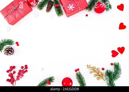 Christmas composition. Christmas ball, pine cones, fir branches on white background. Flat lay, top view, copy space Stock Photo