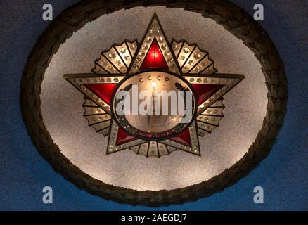 An illuminated Soviet star in the pavilion of The Soviet War Memorial in Treptower Park, Berlin, Germany Stock Photo