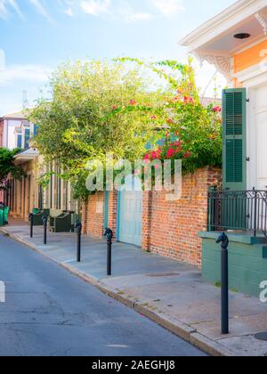 New Orleans, USA - April 22, 2018: Row houses of traditional architecture in Louisiana city on street sidewalk at French Quarter Stock Photo