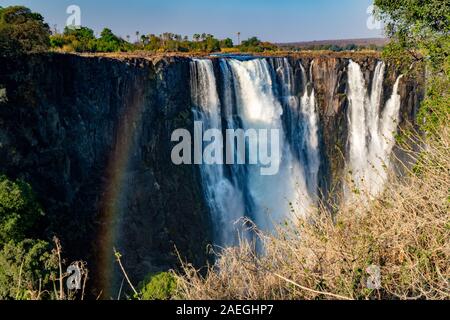 Victoria Falls, Named by David Livingstone in 1855 after Queen Victoria, The waterfall is formed by the Zambezi River falling into a 100 metre deep ch