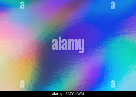 Abstract trendy rainbow holographic background in 80s style. Blurred texture in violet, pink and mint colors with scratches and irregularities. Stock Photo