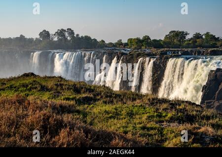 Victoria Falls, Named by David Livingstone in 1855 after Queen Victoria, The waterfall is formed by the Zambezi River falling into a 100 metre deep ch Stock Photo