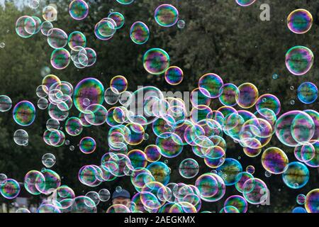 Soap bubbles on green natural background Stock Photo