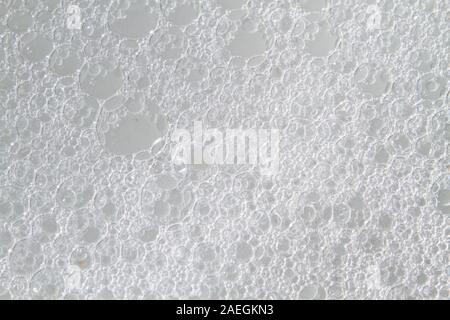 Background of white foam soap bubbles, detergent, shampoo, soap Stock Photo