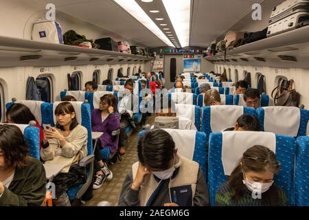 passengers inside Shinkansen bullet train, Tokyo, Japan Stock Photo