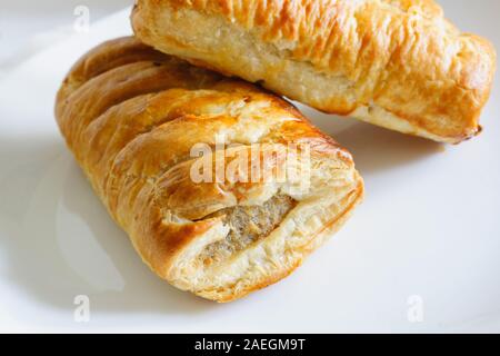 Freshly baked British pork sausage rolls made with puff pastry fresh out of the oven Stock Photo