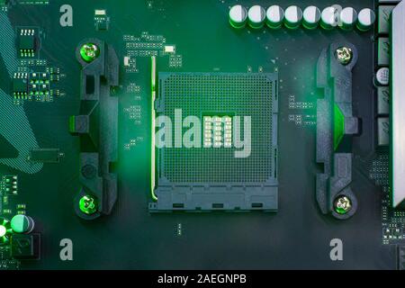 Сomputer component is motherboard without processor. View from above. Green tinted. Stock Photo