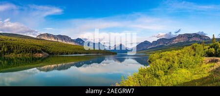 Lake Sherburne is a reservoir formed by Lake Sherburne Dam in the Many Glacier region of Glacier National Park in Montana. Stock Photo
