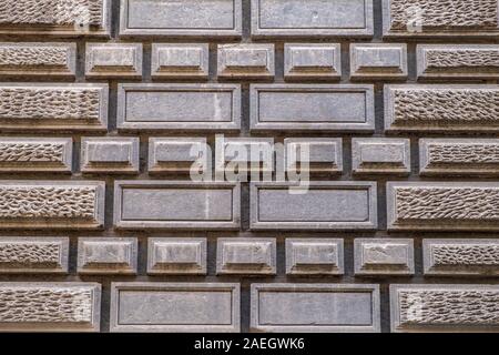 Concrete stone wall with rectangular geometric pattern Stock Photo