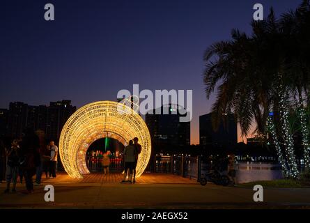 People take photos with a new holiday decoration at Lake Eola Park in Orlando, Florida. Stock Photo