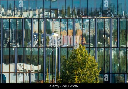 Reflections in glass building, Reykjavik, Iceland Stock Photo