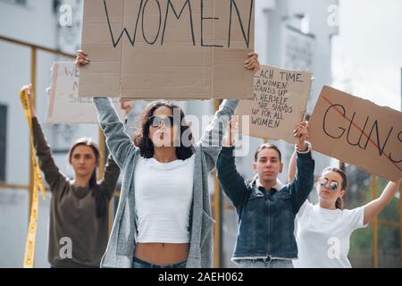 Walking forward. Group of feminist women have protest for their rights outdoors Stock Photo