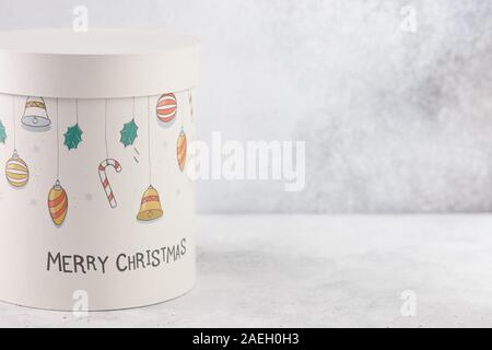 Christmas gift box with print on white table, copy space Stock Photo