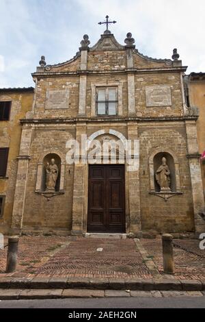 Entrance to small church chiesa di San Pietro in Selci near Fortezza Medicea in Voltera, Tuscany, Italy Stock Photo