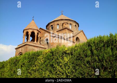 Saint Hripsime Church with the Evergreen Shrubs in Foreground, Vagharshapat City, Armenia Stock Photo