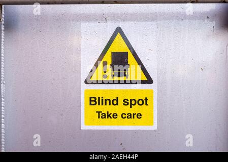 Warning sign on the back of a HGV lorry saying Blind Spot, Take Care Stock Photo