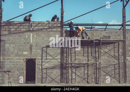 Construction worker is working in the construction site Stock Photo