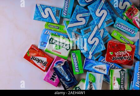 New York NY NOV 29 2019: Various brand of chewing gum in packaging on brands Orbit, Extra, Eclipse, Freedent, Wrigley, Spearmint, Trident, Stride Stock Photo