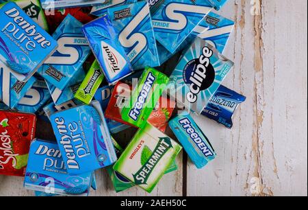 New York NY NOV 29 2019: Various brand of chewing gum in packaging on brands Orbit, Extra, Eclipse, Freedent, Wrigley, Spearmint, Trident, Stride Stock Photo